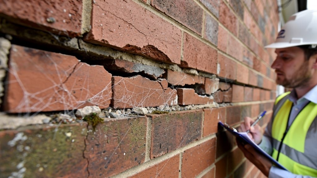 Structural cracks in a brick wall indicating possible subsidence in a Staffordshire property